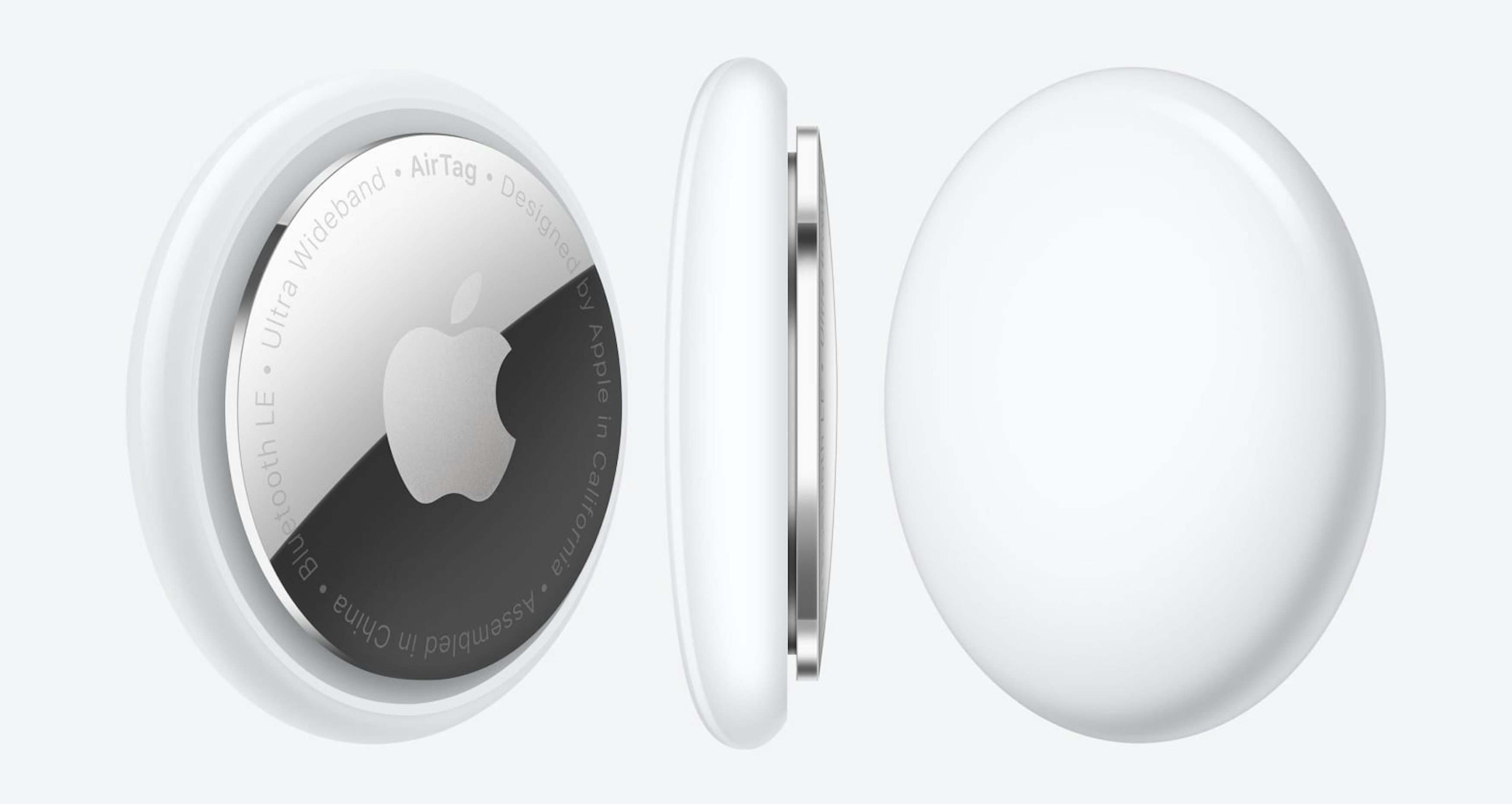 Apple AirTag in Vorder-, Seiten- und Rückansicht.
